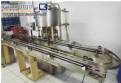 Envasadora rotativa com 12 bicos á vacuo Wada