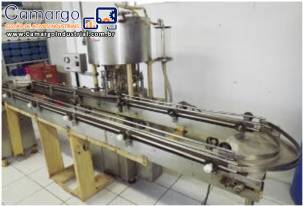 Envasadora rotativa com 12 bicos á vacuo Wada